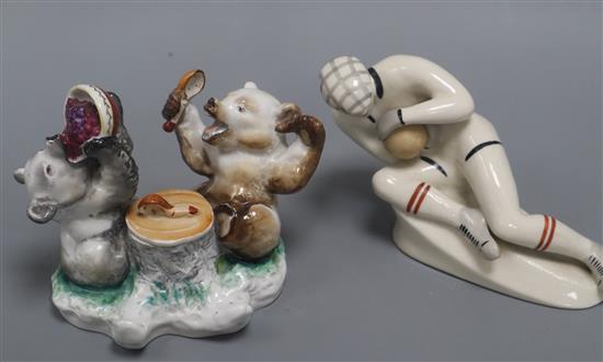A Russian porcelain figure of a goalkeeper and a Russian porcelain inkwell and a box